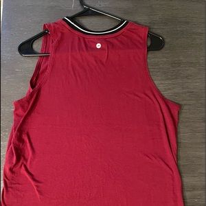 Medium Red with black trim tank without tags but never worn